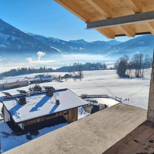 a view from the roof of a house in the snow at Ferienwohnung Kogler Zillertal in Fügenberg