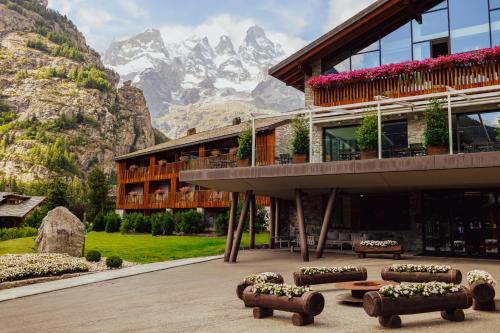a building with a view of a mountain at Grand Hotel Courmayeur Mont Blanc, by R Collection Hotels in Courmayeur