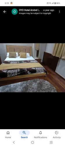 a picture of a bedroom with a bed in a room at Hotal Arvind in Patna