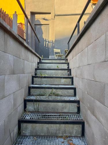 a set of stairs leading up to a house at Suterénní byt na Hejtmánce v Mladé Boleslavi u letiště in Mladá Boleslav