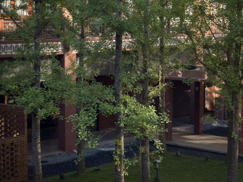 a building with trees in front of it at FunGeeS in Zhangjiajie