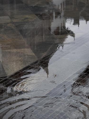 a reflection of a building in the water at FunGeeS in Zhangjiajie