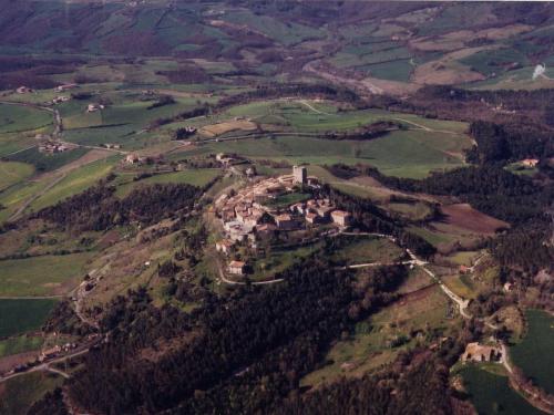 an aerial view of a house on a hill at Tuscan Hilltop Getaway in Montecastelli Pisano