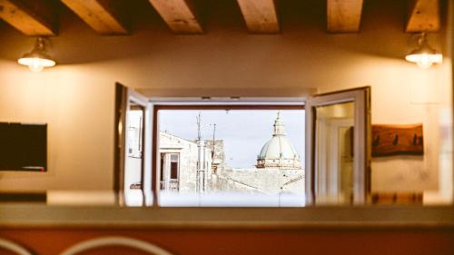 a view of a building from a window at Panormos91 Rooms&Terrace in Palermo