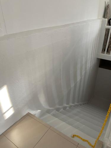a corner of a room with a white wall at Apartment 2 on OxideCBD in Broken Hill