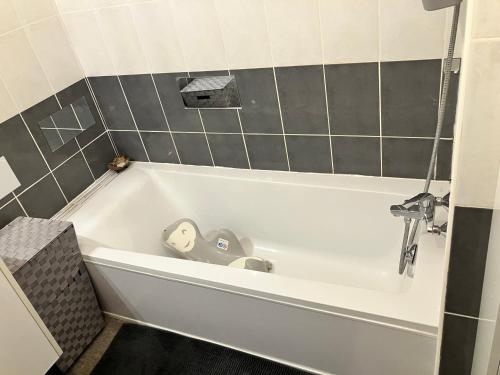 a bath tub with a toy in it in a bathroom at BLUE HORIZON T4 3 bedrooms Panoramic sea view in Saint-Raphaël