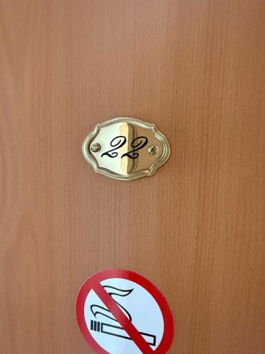 a door with a no smoking sign on it at Hotel am Hafen Havelberg in Havelberg