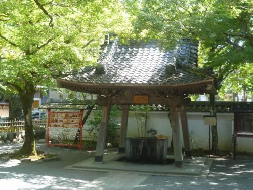a gazebo in front of a building with trees at Onsen Yado Mizuguchi in Izu