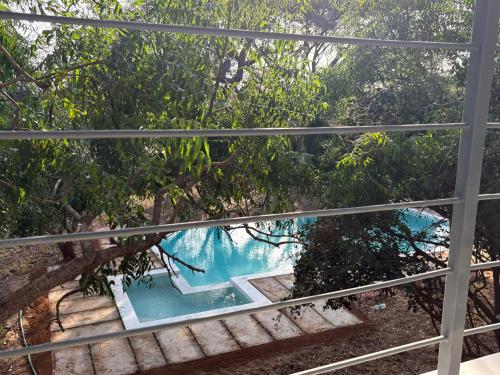 a view from the balcony of the pool at Ashnil Aruba Lodge in Tsavo
