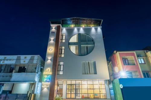 a building with a round window on top of it at Treebo Deluxe Inn, Chromepet in Chennai