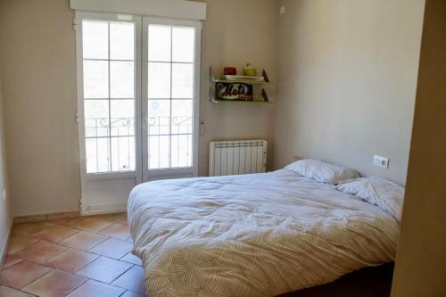 Ένα ή περισσότερα κρεβάτια σε δωμάτιο στο Escape Rural en la Marina Alta