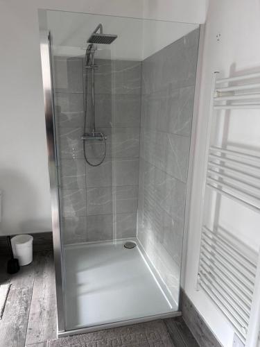 a shower with a glass door in a bathroom at Triple room Private Bath Near LFC Free Street Parking No Breakfast in Liverpool