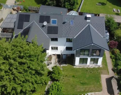 an aerial view of a house with a gray roof at Unger's Ferienwohnung in Isny im Allgäu