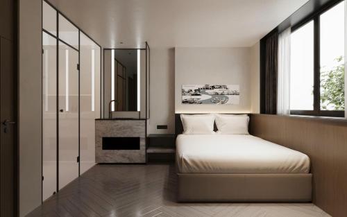 Ein Bett oder Betten in einem Zimmer der Unterkunft PureJoy Hotel Saigon