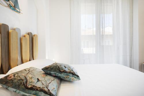 Residenza Aurora del Mareにあるベッド