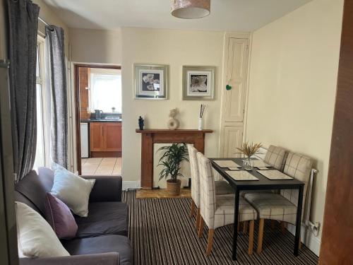 a living room with a couch and a table at 101 - Room 2 - Uplands in Sketty