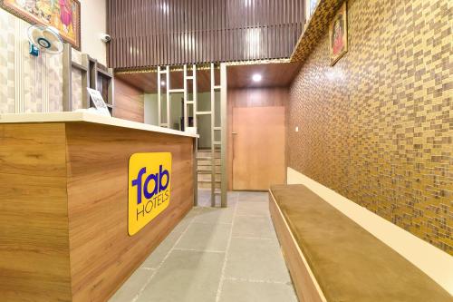 a fast food restaurant with a sign on the wall at FabHotel Shivansh in Jaipur