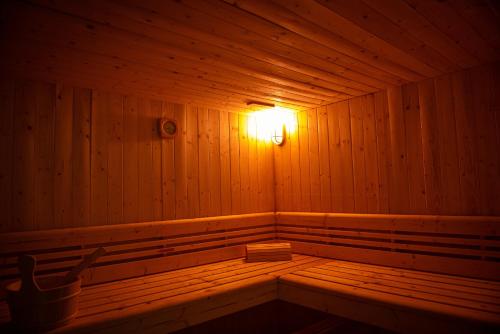 a wooden sauna with a light on the inside at ARTEMIDE "Fiore Club" B&B SUITE SPA in Giffoni Valle Piana