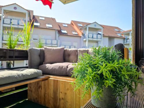 a couch sitting on top of a balcony at SCANDiC-Apartment - Balkony & Garage, 3Z, 80m2 in Pforzheim