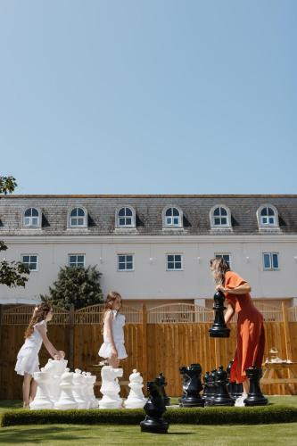a group of people playing a game of chess at Durrant House Hotel in Bideford