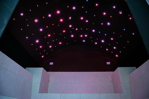 a group of lights on the ceiling of a theatre at ARTEMIDE "Fiore Club" B&B SUITE SPA in Giffoni Valle Piana