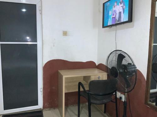 TV o dispositivi per l'intrattenimento presso Optizee Hotel & Suites