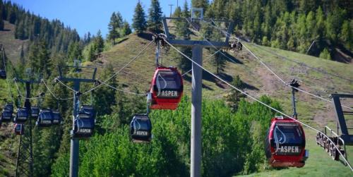 a group of gondolas on a ski lift at Renovated 2 BR Aspen Condo Ski-in out in Aspen