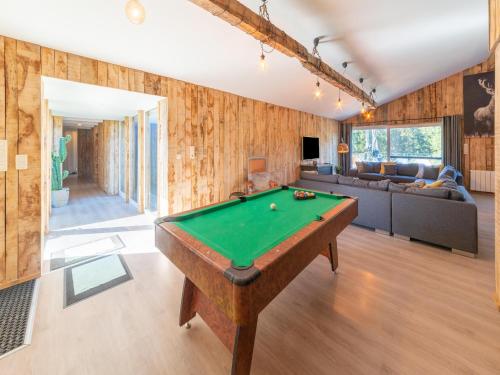 a living room with a pool table in it at Lush chalet near lake of Bütgenbach in Wirtzfeld
