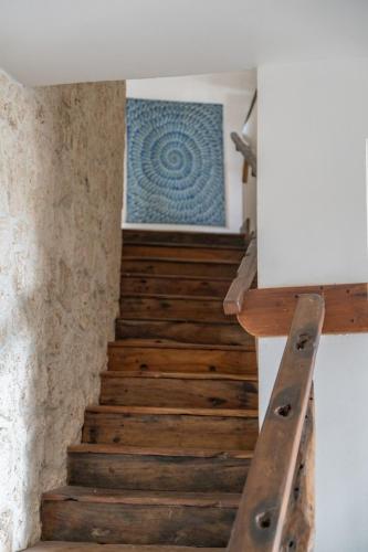 a staircase in a house with a blue tile on the wall at Villa Juliana in Jambiani