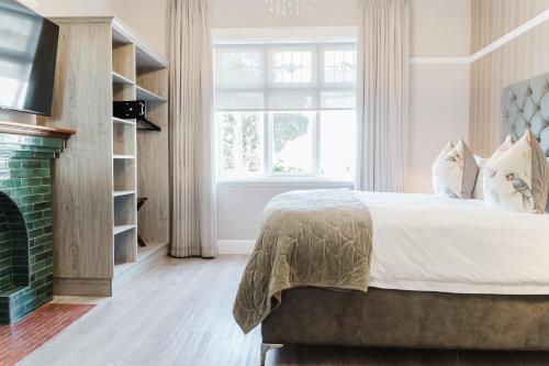 En eller flere senge i et værelse på Cloud 9 Boutique Hotel and Spa