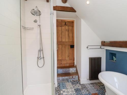 a bathroom with a shower and a toilet at Bruno's Bothy in Belford