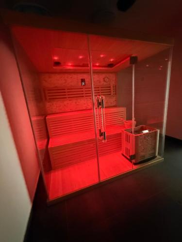 a room with red lights in a red room at Villa Lilien Residence Tatry in Veľká Lomnica