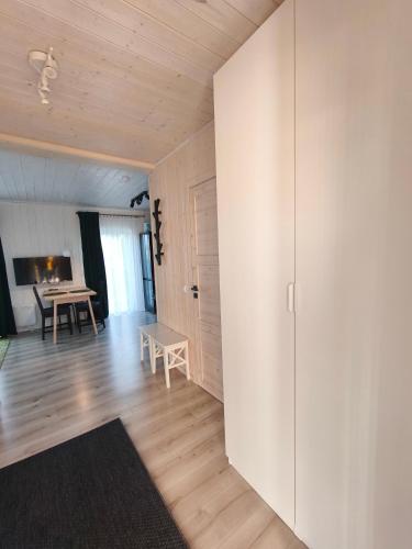 a living room with a sliding door and a table at Gervių takas 2 