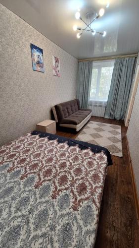 Llit o llits en una habitació de Квартира