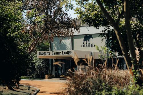 a sign for the entrance to ayers ranger game lodge at Mantis Akagera Game Lodge in Akagera