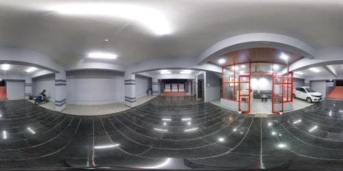 an empty building with a car in the middle at Hotel Virat Stay in Hyderabad