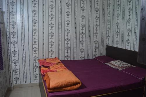 Una cama o camas en una habitación de Hotel Goura