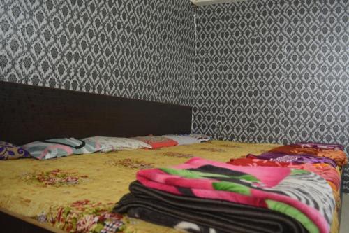 Una cama o camas en una habitación de Hotel Goura