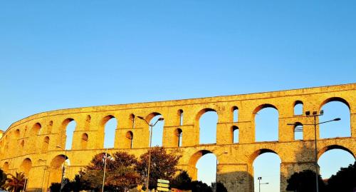 a large amphitheater with arches on top of it at Campus Verde in Eleftheres