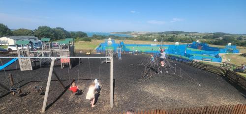 a group of people playing in a playground at The island escape isle of wight in Porchfield