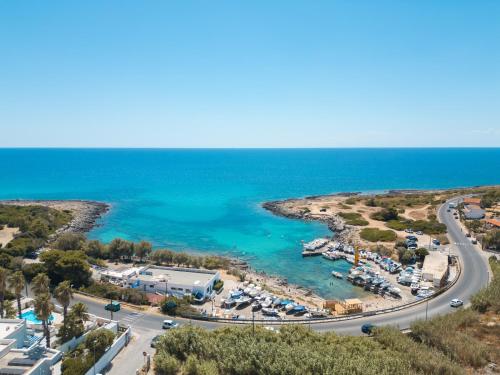 an aerial view of a marina and the ocean at BeBaia in Leporano Marina