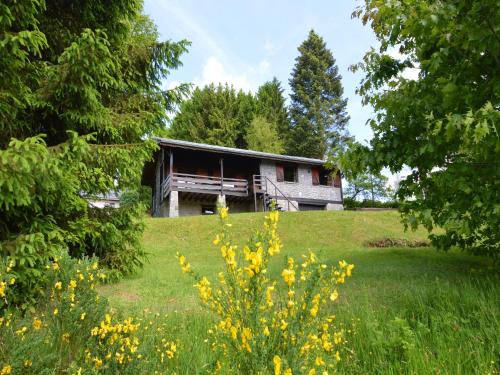 an old house in the middle of a field at Tranquil Ardennes Retreat in Vencimont