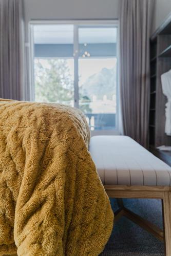 En eller flere senge i et værelse på Cloud 9 Boutique Hotel and Spa