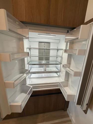 an empty refrigerator with its door open in a kitchen at New 1Bed 1 bath Ocean view in Miami Beach