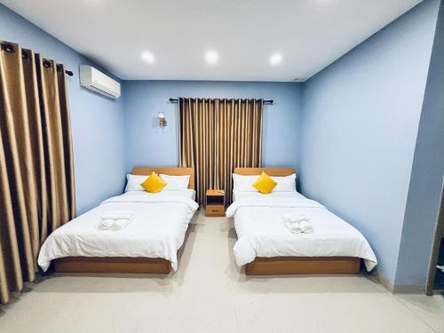 Cama o camas de una habitación en DLSD Hotel