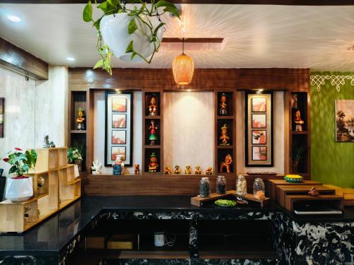 a restaurant with a lot of items on the wall at Holiday Residency Coimbatore in Coimbatore