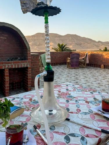 a glass lamp sitting on top of a table at Karima House in Luxor
