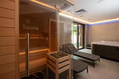 a sauna in a room with a bed at Apartmány Hraničná s privátním wellness in Bedřichov