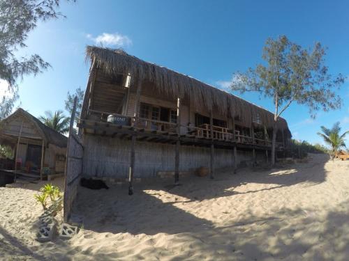 a hut on the beach in the sand at Stunning sea view, charming beach house in Barra, Mozambique - 4x4 in Miramar