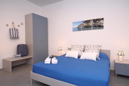 Katil atau katil-katil dalam bilik di Verdemare relax & rooms